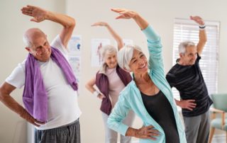 Seniors stretching during a workout class