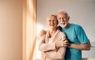 A happy senior couple laugh and smile at the senior independent living in Michigan