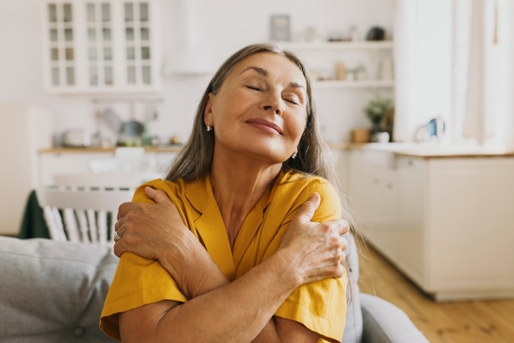 Woman practicing self care in senior apartment communities Madison Heights.